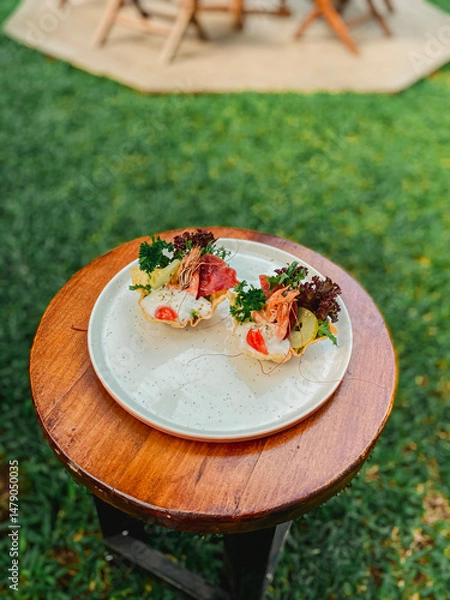 Fototapeta Artistic depiction of a vibrant salad on a rustic table, capturing the essence of outdoor dining