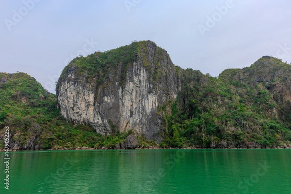 Obraz Halong Ha Long Bay Hanoi this Vietnamese wonder is littered with mountains and Rock cliffs popping out of the ocean, lush green mountains in Vietnam