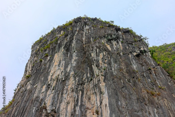 Obraz Halong Ha Long Bay Hanoi this Vietnamese wonder is littered with mountains and Rock cliffs popping out of the ocean, lush green mountains in Vietnam