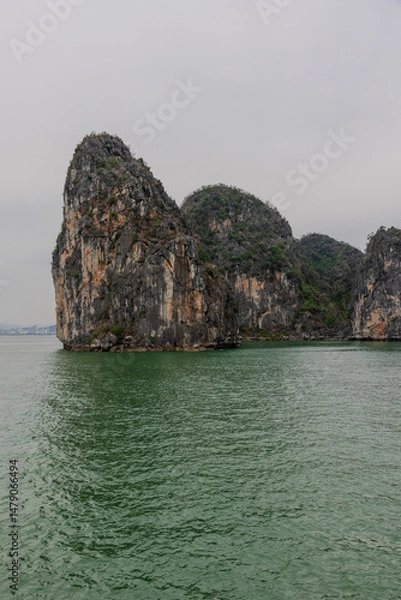 Obraz Halong Ha Long Bay Hanoi this Vietnamese wonder is littered with mountains and Rock cliffs popping out of the ocean, lush green mountains in Vietnam
