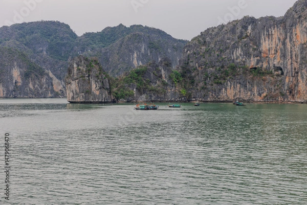 Obraz Halong Ha Long Bay Hanoi this Vietnamese wonder is littered with mountains and Rock cliffs popping out of the ocean, lush green mountains in Vietnam