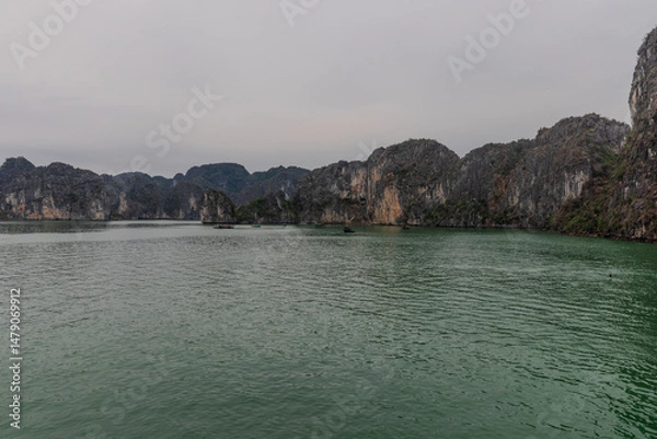 Obraz Halong Ha Long Bay Hanoi this Vietnamese wonder is littered with mountains and Rock cliffs popping out of the ocean, lush green mountains in Vietnam