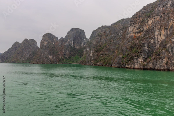 Obraz Halong Ha Long Bay Hanoi this Vietnamese wonder is littered with mountains and Rock cliffs popping out of the ocean, lush green mountains in Vietnam