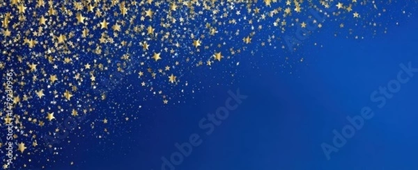 Obraz Gold star confetti on a deep blue background