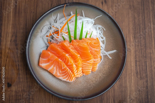 Fototapeta Salmon slice sashimi salad on ceramic bowl japanese food in restuarant