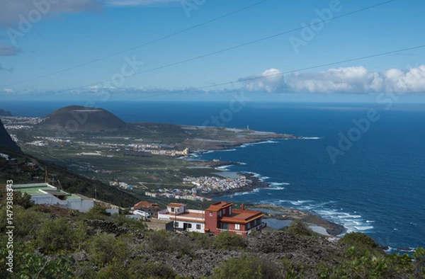Fototapeta Aerial view of colorful houses near old town Garachico from Mirador de Garachico view point.. Green cean shore with lava rocks. Popular tourist destination, Tenerife Canary Islands.