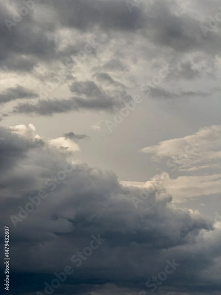 Obraz Dramatic Heavy Clouds Form a Captivating Sky, Hinting at Potential Rain in the Early Evening Twilight