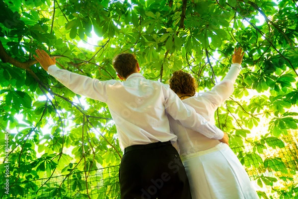 Obraz happy newlyweds couple relax in the park. High quality photo