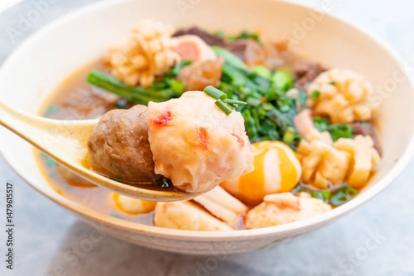 Fototapeta angle view bowl of ChaoZhou beef offal and various seafood ingredients at horizontal composition