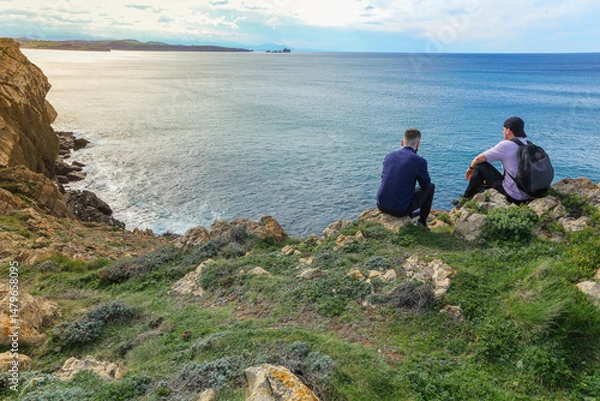 Obraz Two people walking through the landscape of the Costa Quebrada in Cantabria