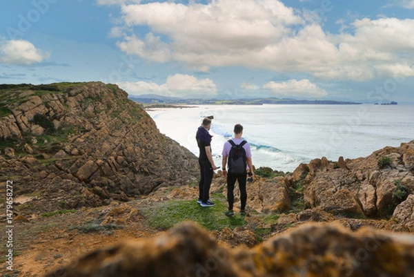 Obraz Two people walking through the landscape of the Costa Quebrada in Cantabria
