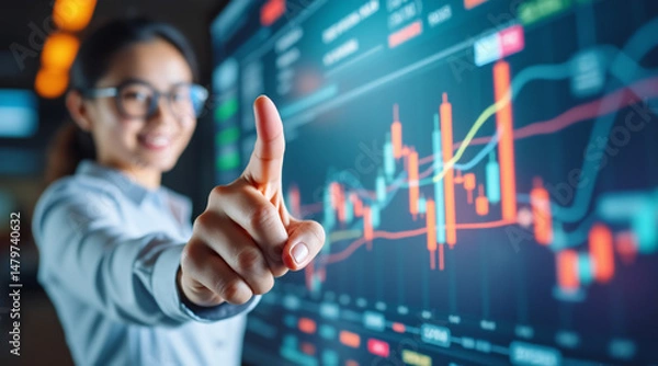Fototapeta Businesswoman Analyzing Stock Market Trends Using Touch Screen Digital Interface