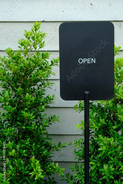 Fototapeta Welcoming Open Sign for Your Local Shop Entrance