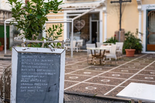 Obraz italian restaurant outdoor patio with menu sign