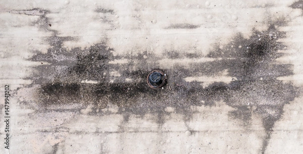 Fototapeta Directly above a white flat roof building drain 