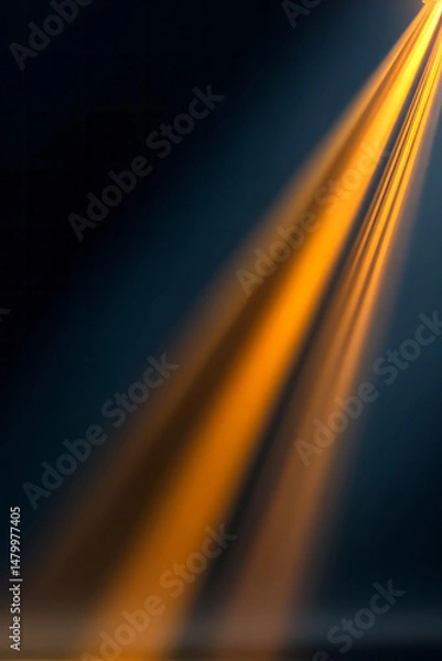 Fototapeta Golden light rays piercing dark background, generating textured abstract composition with spacious negative area, suitable for digital creative projects