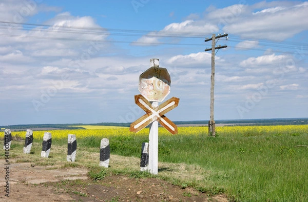 Fototapeta old railway crossing in the countryside on a sunny day