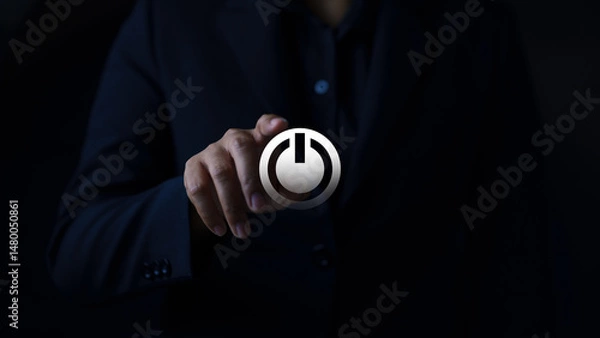 Fototapeta Digital interaction action person engaging with power button office setting dark environment close-up concept