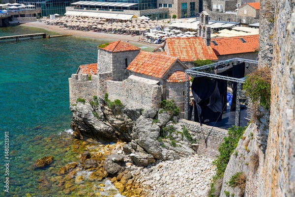 Fototapeta Church of Sabbas the Sanctified built on the fortification walls of the Old Town of Budva on the coast of the Adriatic Sea in Montenegro