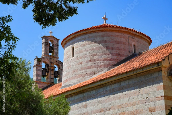 Fototapeta Cupola of the Holy Trinity Church in the Old Town of Budva on the coast of the Adriatic Sea in Montenegro