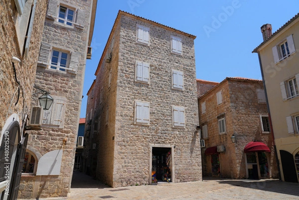 Fototapeta Stone house in the Old Town of Budva, a walled coastal city built by the Venetian Republic along the coast of the Adriatic Sea in Montenegro