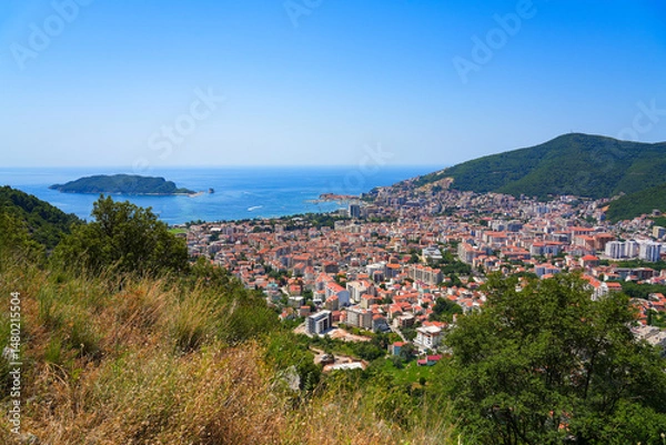 Fototapeta Aerial view of Budva, a famous resort town on the Montenegrin Riviera along the coast of the Adriatic Sea