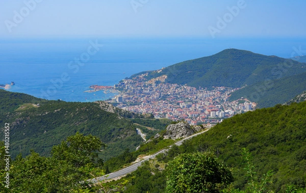 Fototapeta Aerial view of Budva, a famous resort town on the Montenegrin Riviera along the coast of the Adriatic Sea