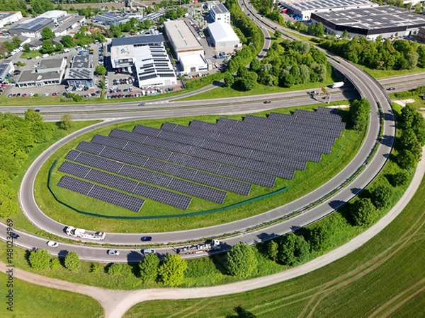Obraz Aerial drone photo of photovoltaic solar panels next to a motorway access