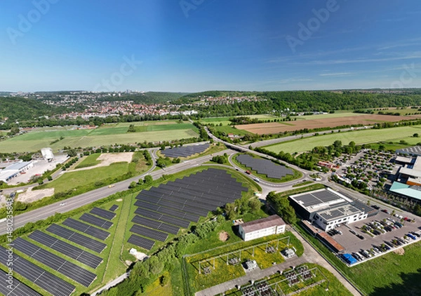 Obraz Aerial drone panorama photo of photovoltaic solar panels next to the highway