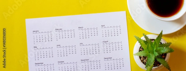 Fototapeta Top View of Calendar for Planner and organizer to plan and remind daily appointments, meeting agenda, schedule, timetable, job management with yellow background. Calendar reminder event Concept.