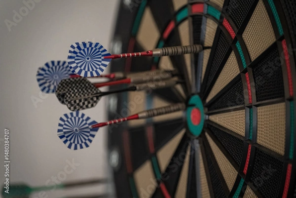 Fototapeta Darts stuck in the target.
