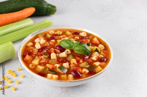 Obraz Italian Minestrone soup with ingredients for cooking on white background. Italian, Mediterranean cuisine.