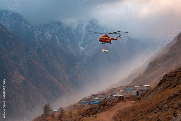 Obraz Helicopter Drops Emergency Supplies Over Isolated Mountain Village Below
