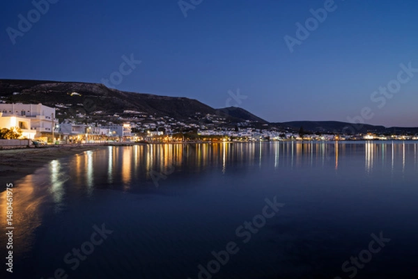 Fototapeta Scenic view of Paroikia (Parikia) town by the Aegean Sea on Paros island in Greece at dusk.