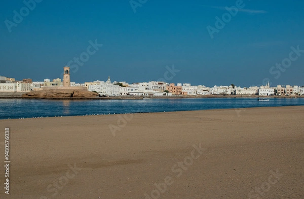 Obraz Oman, Middle East, 03-11-2025: panoramic view of the main beach of Sur, the capital city of Ash Sharqiyah South Governorate, on the coast of the Gulf of Oman, and the skyline of the old town