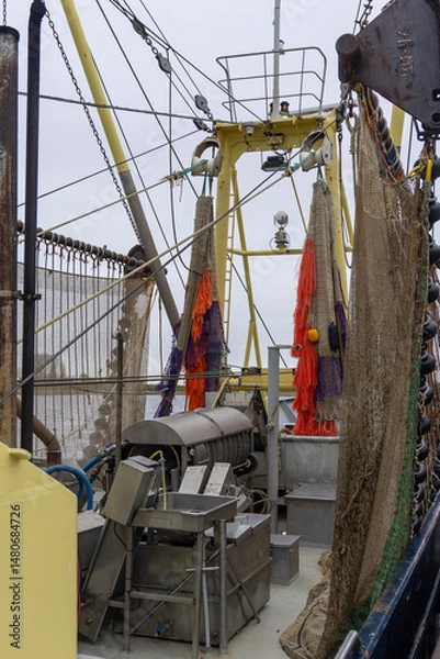 Fototapeta Sorting-cooking plant and sieving machine at fishing trawler in Dutch harbor Zoutkamp in Groningen the Netherlands