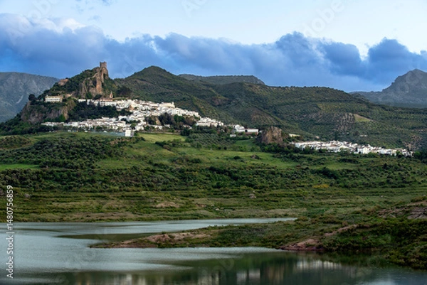 Fototapeta Zahara de la Sierra on a cloudy day with lake view