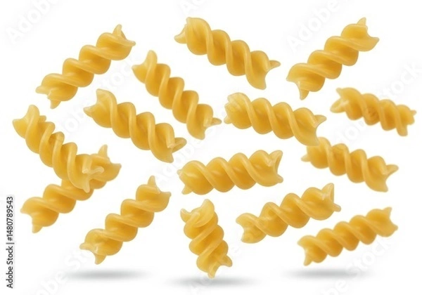 Fototapeta Close up of uncooked fusilli pasta spirals scattered on a white background in studio shot