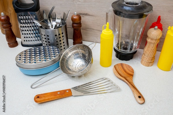Obraz A kitchen counter with various utensils and kitchen tools
