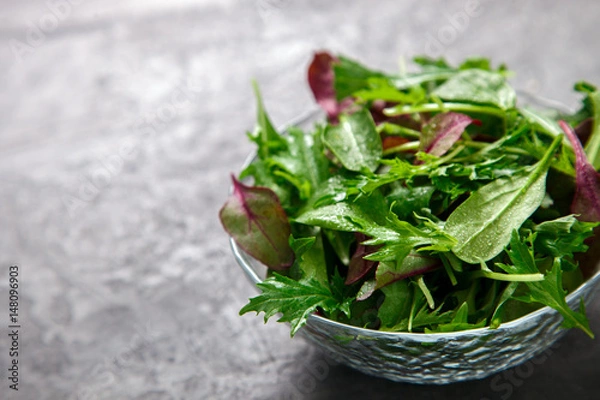 Fototapeta Fresh Green Mix Salad .Leaves Of Spinach,Arugula,Romaine,Lettuce.Concept of Healthy Food.Copy space for Text.Vegetarian. selective focus.