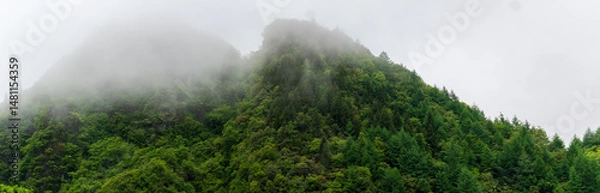 Obraz mountains and valleys where fog and clouds rise.