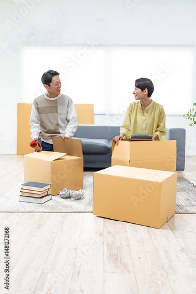 Fototapeta 引越しの準備をする夫婦