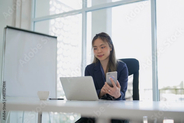 Fototapeta Businesswoman working with data spreadsheet documents at workplace