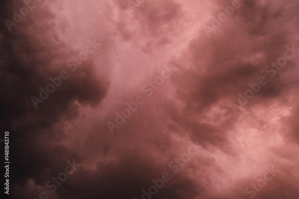 Obraz Fiery red storm clouds with dramatic lighting. Red storm clouds background. Dramatic red sky.