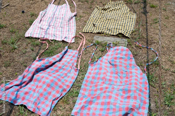 Obraz Clothes lying on the sidewalk for to dry, lifestyle and culture of India, dhobi ghat laundry washing in Kochi, Asia