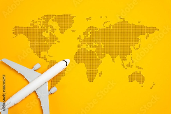 Fototapeta Airplane and world map. Passenger air transportation. International flights. World tourism. Worldwide passenger movement, globalization, and the importance of efficient transportation networks.