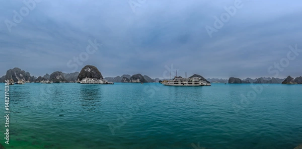 Obraz Halong Ha Long Bay Hanoi this Vietnamese wonder is littered with mountains and Rock cliffs popping out of the ocean, lush green mountains in Vietnam
