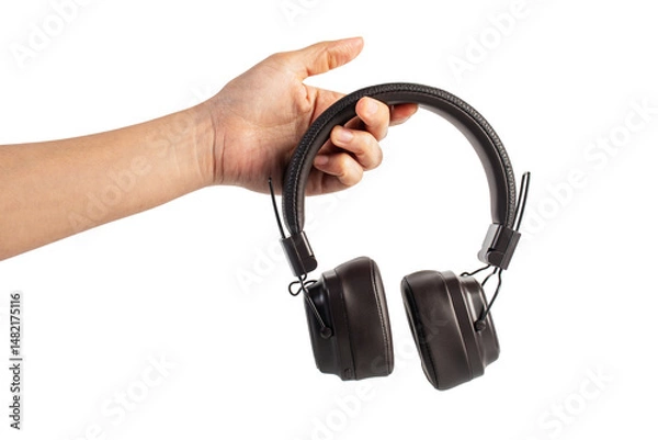 Fototapeta HeadPhones in hand, Headphones isolate on transparent. Wireless headphones in brown.