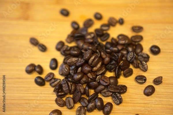 Obraz Close-up of roasted coffee beans on a wooden surface