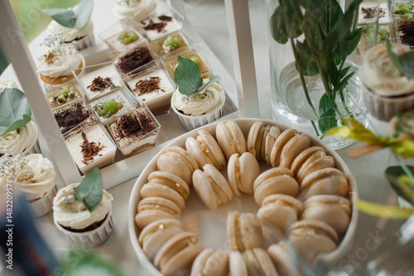 Fototapeta Wedding day. Buffet table with various types of snacks and sweets in the celebration hall